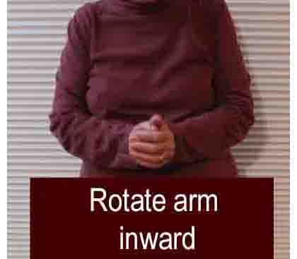 photo shows a woman with her hands together in front of her.